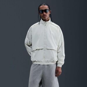 Nike Solo Swoosh Track Jacket in Light Bone/White